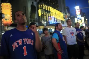 knicks-fan-stephen-florival-queens-waits-for-decision-nba-player-lebron-james-times-square-new-york.jpg